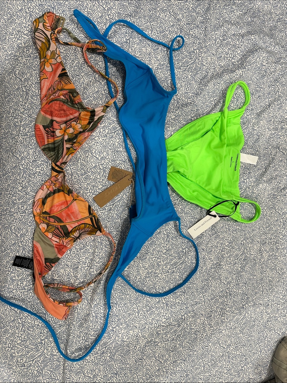 Bundle. One large swim bottom and two medium tops.
